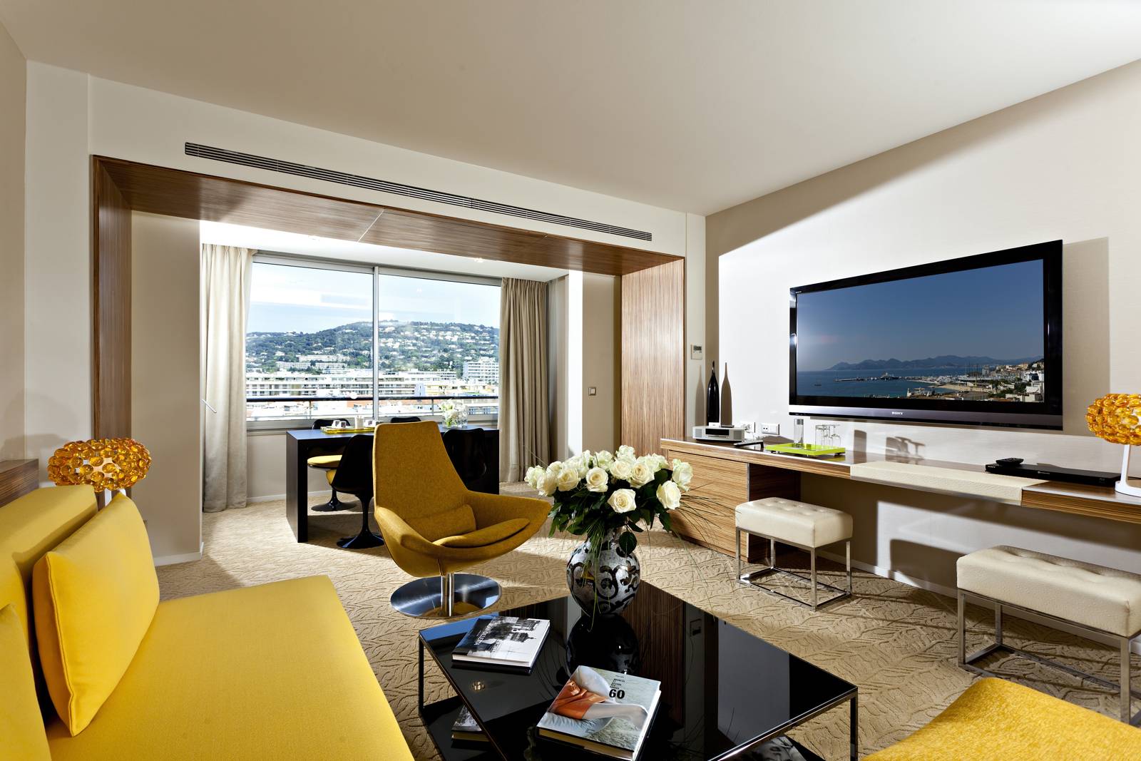 Grand Hotel Cannes bedroom living room. - Gitaly contract Grand Hotel Cannes bedroom living room lit by large window. - It's time to holiday - Gitaly contract